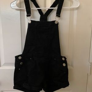Black ripped overalls